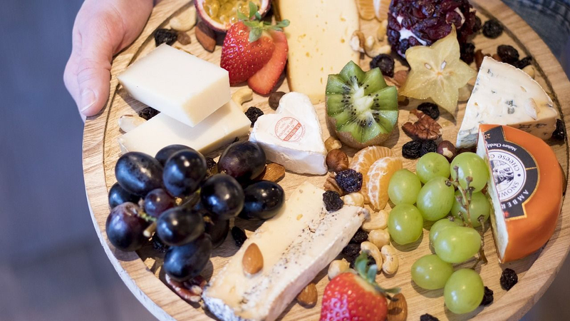 cheese and fruit board, featured in Villa Pereire’s blog on how to host an apero, a French happy hour